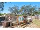 Backyard above ground swimming pool and wooden deck surrounded by lush greenery with privacy fencing at 275 S Highland Ave, Tarpon Springs, FL 34689