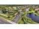 Aerial view of the community with lush landscaping, serene water features, and a well-maintained entrance at 297 Countryside Key Blvd, Oldsmar, FL 34677