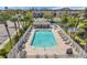 An inviting community pool offering ample lounge seating, lush landscaping, and a refreshing escape at 297 Countryside Key Blvd, Oldsmar, FL 34677