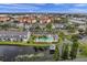 Overhead view featuring a community pool, a pond with a gazebo and well-maintained landscaping in a desirable residential area at 297 Countryside Key Blvd, Oldsmar, FL 34677