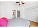 Bedroom features a ceiling fan, closet and a bathroom at 297 Countryside Key Blvd, Oldsmar, FL 34677