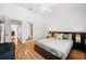 Bedroom with dark wood furnishings and a view into the ensuite bathroom at 297 Countryside Key Blvd, Oldsmar, FL 34677