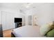A bright bedroom with a view into the en suite bathroom at 297 Countryside Key Blvd, Oldsmar, FL 34677