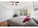 Bedroom features a ceiling fan, closet and a window at 297 Countryside Key Blvd, Oldsmar, FL 34677
