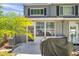 Exterior view of the patio with door and windows, perfect for enjoying the outdoor scenery at 297 Countryside Key Blvd, Oldsmar, FL 34677