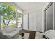 Enclosed patio with an exit door and view to backyard at 297 Countryside Key Blvd, Oldsmar, FL 34677