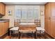 Dining Area featuring table, chairs, wood floor, window and plantation shutters at 3076 Eastland Blvd # 305, Clearwater, FL 33761