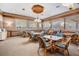 Dining area with seating for many, light color scheme and many windows at 3076 Eastland Blvd # 305, Clearwater, FL 33761