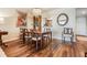 Dining Room showcasing an elegant chandelier, wood flooring, and cozy seating at 3076 Eastland Blvd # 305, Clearwater, FL 33761