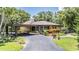 Charming single-story home featuring beautiful landscaping and a covered carport at 3076 Eastland Blvd # 305, Clearwater, FL 33761