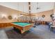 Game room complete with a pool table and workout equipment bathed in natural light from the many windows at 3076 Eastland Blvd # 305, Clearwater, FL 33761