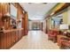Bright hallway with wood paneling, sconces, and seating with views to the outside at 3076 Eastland Blvd # 305, Clearwater, FL 33761