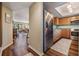 Kitchen featuring wooden cabinets, stainless steel appliances and view to the living room at 3076 Eastland Blvd # 305, Clearwater, FL 33761