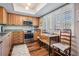 Charming kitchen featuring wood cabinets, stainless appliances, and plantation shutters at 3076 Eastland Blvd # 305, Clearwater, FL 33761