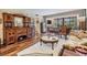 Living Room showcasing furniture, antiques, wood floors and a view to the screened balcony at 3076 Eastland Blvd # 305, Clearwater, FL 33761