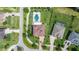 Aerial view of a home with a pool, patio, and large yard in a residential area at 3226 Cordoba Ranch Blvd, Lutz, FL 33559