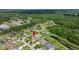 Aerial view of the home with lush surroundings and a pond in a desirable neighborhood at 3226 Cordoba Ranch Blvd, Lutz, FL 33559