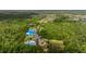 Drone shot of community amenities including the community pool, playground, tennis court, dog park and walking trails at 3226 Cordoba Ranch Blvd, Lutz, FL 33559