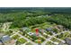 Aerial view of the home located near a pond and surrounded by lush greenery in a quiet neighborhood at 3226 Cordoba Ranch Blvd, Lutz, FL 33559