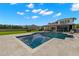 Backyard features a swimming pool, patio, and manicured lawn at 3226 Cordoba Ranch Blvd, Lutz, FL 33559