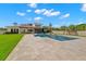 Spacious backyard with a pool, patio, well-manicured lawn, and pergola at 3226 Cordoba Ranch Blvd, Lutz, FL 33559
