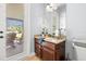 Bathroom vanity with granite countertop and access to the outdoor lanai at 3226 Cordoba Ranch Blvd, Lutz, FL 33559