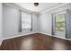 Bedroom with hardwood floors, and natural light from two windows at 3226 Cordoba Ranch Blvd, Lutz, FL 33559
