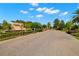 Cordoba Estates entrance with lush landscaping and a view down the community street at 3226 Cordoba Ranch Blvd, Lutz, FL 33559