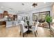 A dining area with an open layout to the kitchen and easy access to a comfortable outdoor space at 3226 Cordoba Ranch Blvd, Lutz, FL 33559