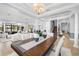 Elegant dining room with tray ceilings, chandelier, and direct access to the living room and staircase at 3226 Cordoba Ranch Blvd, Lutz, FL 33559