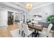Inviting dining room featuring a stylish table, seating for six, and staircase nearby at 3226 Cordoba Ranch Blvd, Lutz, FL 33559