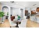 Dining area with a view of the kitchen, featuring stainless steel appliances and granite countertops at 3226 Cordoba Ranch Blvd, Lutz, FL 33559