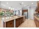 Open concept kitchen featuring stainless appliances, granite counters, a large island, and a breakfast nook at 3226 Cordoba Ranch Blvd, Lutz, FL 33559