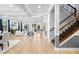 Expansive living area boasts tiled floors, stylish columns, and staircase with ornate railings at 3226 Cordoba Ranch Blvd, Lutz, FL 33559