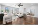 Bright living room with hardwood floors, recessed lighting, and an open layout with white furnishings at 3226 Cordoba Ranch Blvd, Lutz, FL 33559