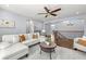 Spacious living room boasts hardwood floors, recessed lighting, and an open layout with a staircase at 3226 Cordoba Ranch Blvd, Lutz, FL 33559