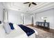 Bright main bedroom features hardwood floors, contemporary furniture, and arched doorways leading to other areas of the home at 3226 Cordoba Ranch Blvd, Lutz, FL 33559