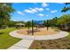 Community playground with multiple play areas and shaded seating at 3226 Cordoba Ranch Blvd, Lutz, FL 33559