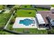 Aerial view of a backyard pool with a large, well-maintained lawn and privacy fence at 3226 Cordoba Ranch Blvd, Lutz, FL 33559