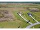 Expansive property featuring a well-manicured lawn, mature landscaping, and a private driveway at 3487 Recurve Cir, Sarasota, FL 34240