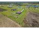 Sprawling property featuring lush lawns, a fenced backyard, and mature landscaping, perfect for outdoor enjoyment at 3487 Recurve Cir, Sarasota, FL 34240