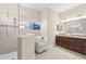 Modern bathroom features a glass-enclosed shower, a double sink vanity, and elegant tile flooring at 3487 Recurve Cir, Sarasota, FL 34240