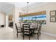 Breakfast nook with an outdoor view of pool and manicured yard at 3487 Recurve Cir, Sarasota, FL 34240