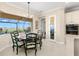 Cozy breakfast nook area with views of the pool and landscaping at 3487 Recurve Cir, Sarasota, FL 34240