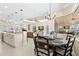 Breakfast nook area with a view of the living area and stainless steel appliances in kitchen at 3487 Recurve Cir, Sarasota, FL 34240