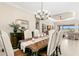 Bright dining room with modern decor and seating for six showcases an open floor plan at 3487 Recurve Cir, Sarasota, FL 34240