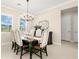 Dining area with a large window offers a picturesque view and natural light at 3487 Recurve Cir, Sarasota, FL 34240