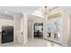 Bright entryway with access to the kitchen and double doors leading to the outside at 3487 Recurve Cir, Sarasota, FL 34240