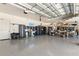 Spacious garage with epoxy floors and custom storage cabinets, offering ample space for vehicles and organization at 3487 Recurve Cir, Sarasota, FL 34240