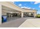 Open garage showcasing organized storage, epoxy floors, and space for multiple vehicles and hobbies at 3487 Recurve Cir, Sarasota, FL 34240